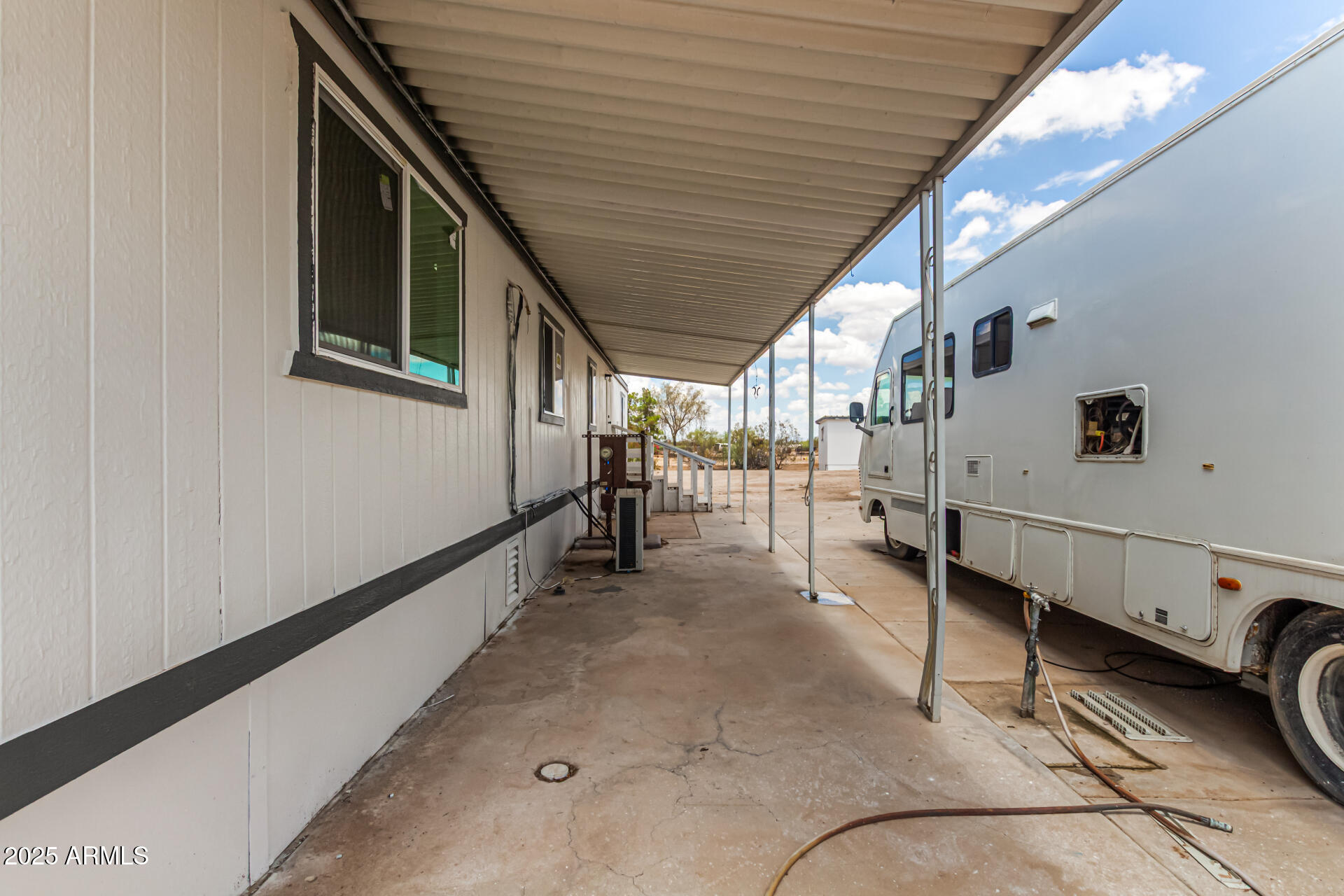 3663 North Thistle Drive Florence, AZ 85132 - Photo 29 of 29 a view of a hallway with workspace