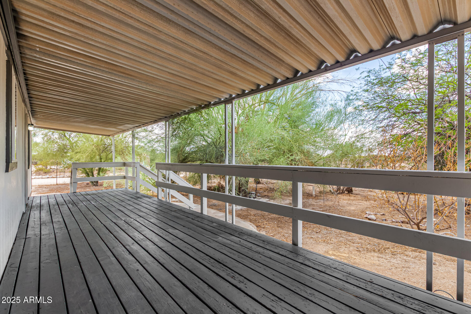 3663 North Thistle Drive Florence, AZ 85132 - Photo 4 of 29 a view of two chairs in the balcony