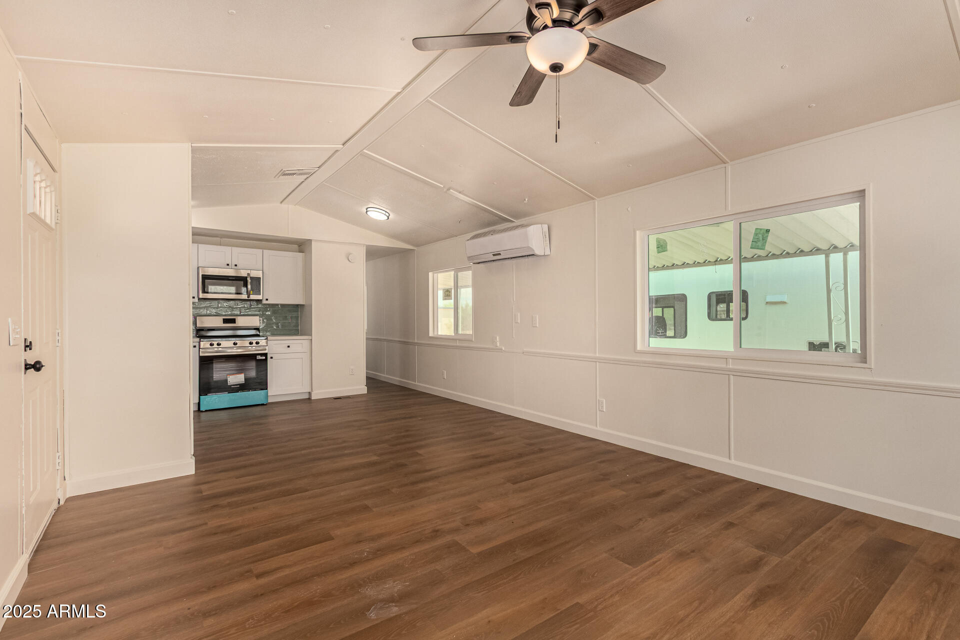 3663 North Thistle Drive Florence, AZ 85132 - Photo 6 of 29 wooden floor in an empty room with a window