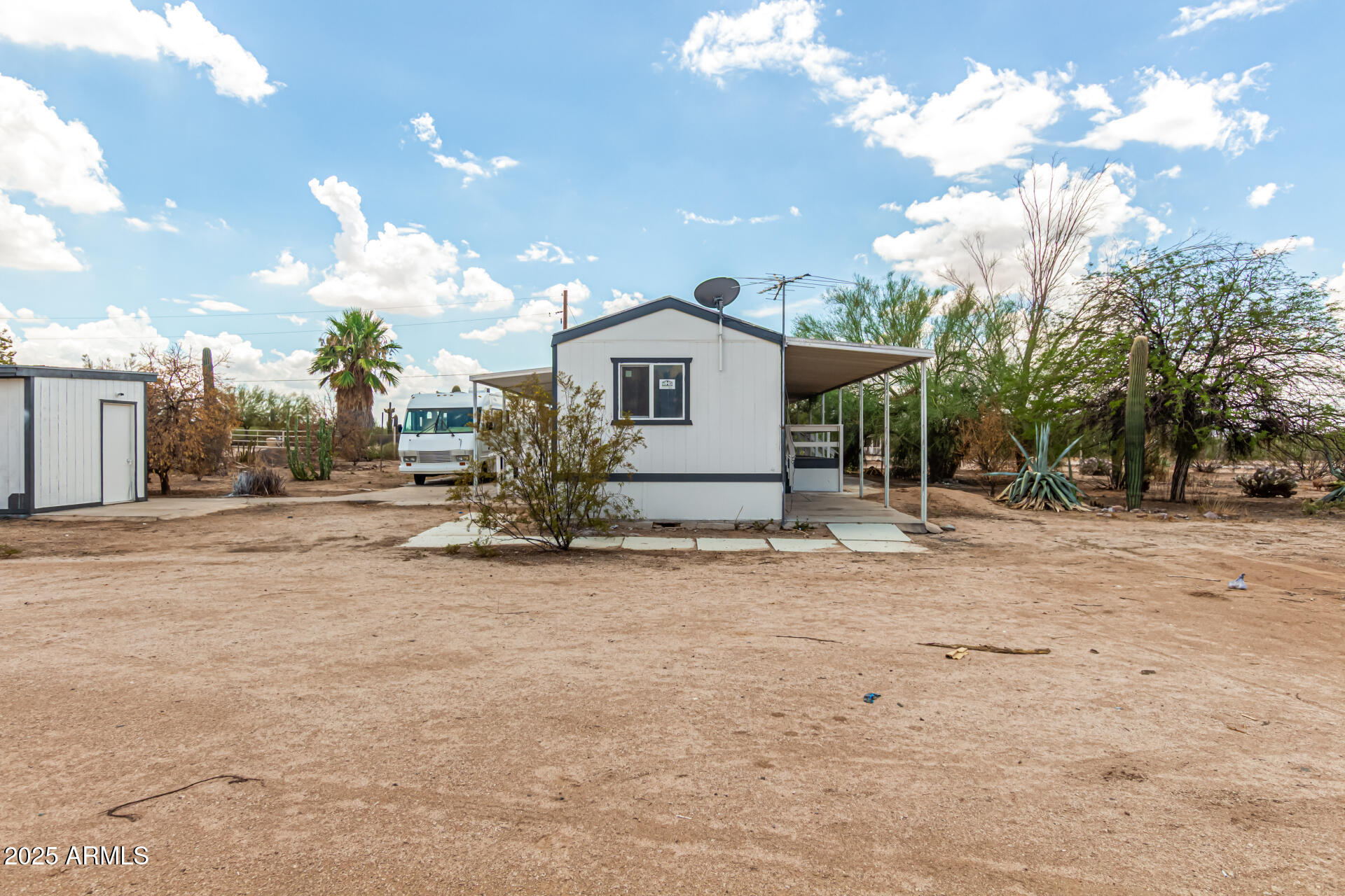 3663 North Thistle Drive Florence, AZ 85132 - Photo 9 of 29 a view of a house with a backyard