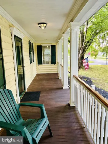 a view of a balcony with cars parked