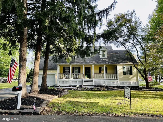 a front view of house with swimming pool and porch