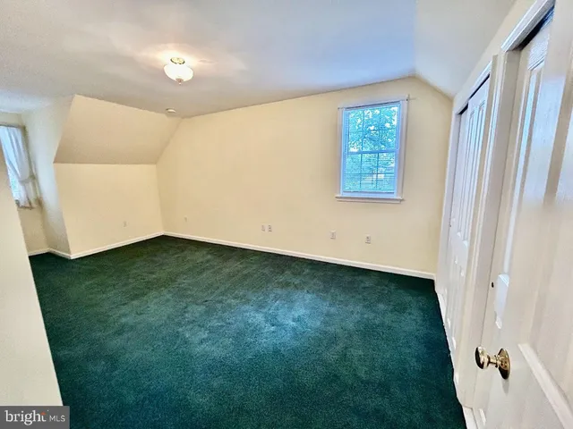 a bathroom with a bathtub sink and mirror