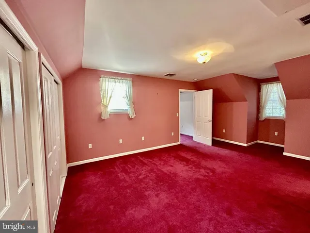 a view of a room with staircase and windows