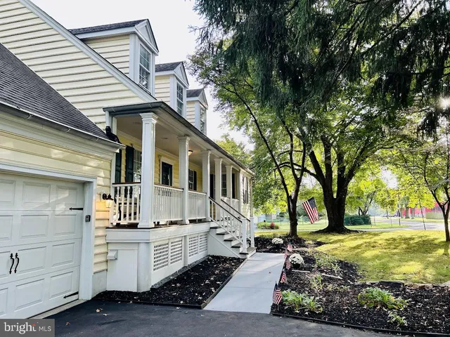 a view of a porch with wooden floor and stairs