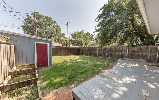 a view of backyard with green space