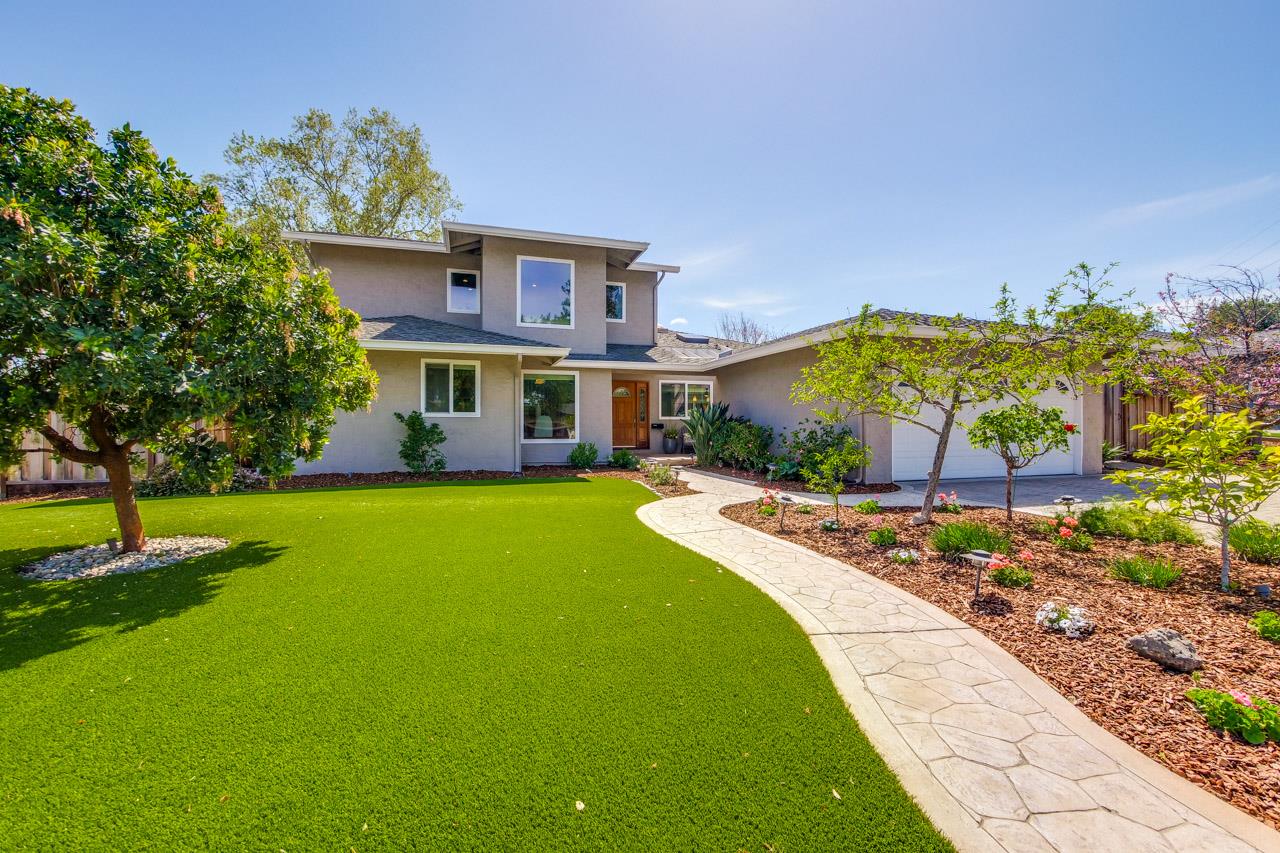 22266 Hartman Drive Cupertino, CA 95014 - Photo 2 of 73 a front view of a house with a garden and plants
