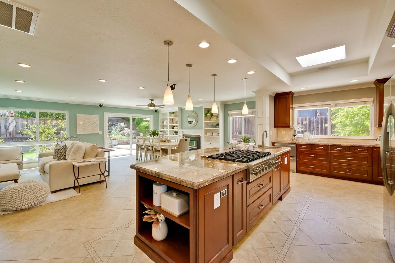 22266 Hartman Drive Cupertino, CA 95014 - Photo 22 of 73 a large kitchen with stainless steel appliances granite countertop a large counter top and stove
