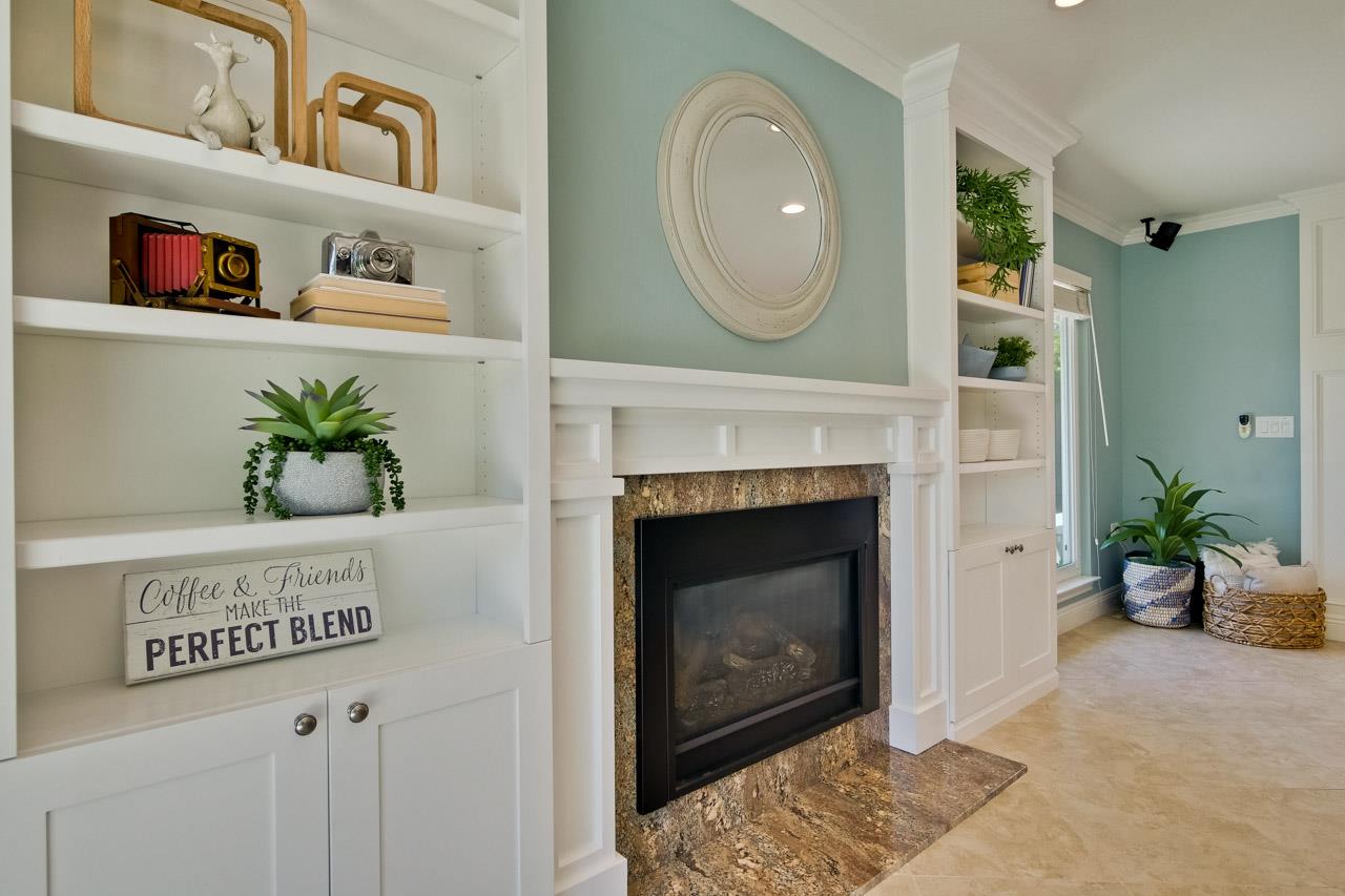 22266 Hartman Drive Cupertino, CA 95014 - Photo 25 of 73 a view of living room with furniture and a fireplace