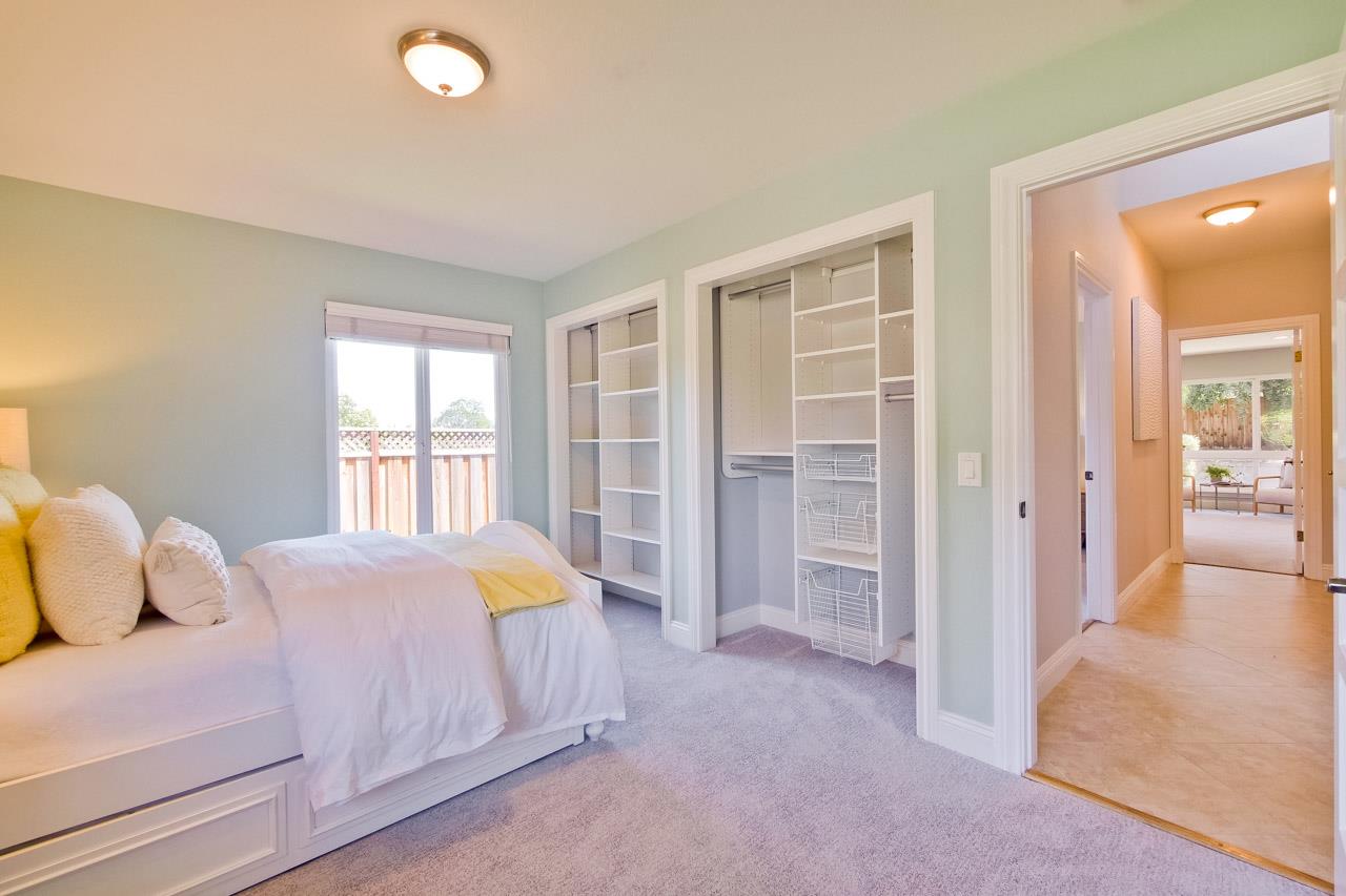 22266 Hartman Drive Cupertino, CA 95014 - Photo 31 of 73 a bedroom with a bed and a window