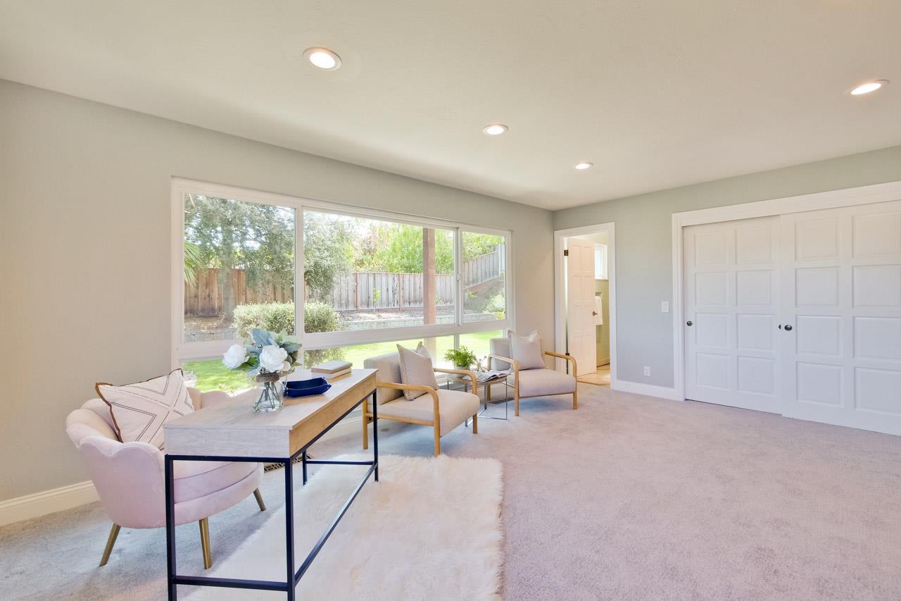 22266 Hartman Drive Cupertino, CA 95014 - Photo 34 of 73 a living room with furniture and a window