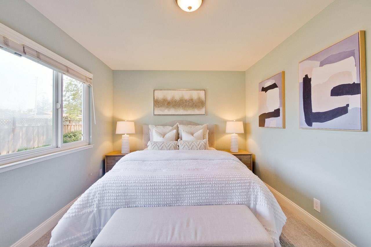 22266 Hartman Drive Cupertino, CA 95014 - Photo 37 of 73 a bedroom with a large bed and a large window