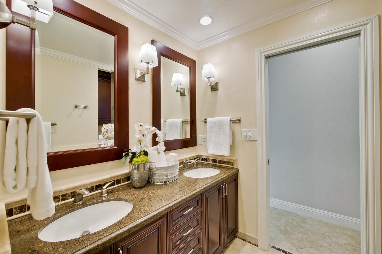 22266 Hartman Drive Cupertino, CA 95014 - Photo 39 of 73 a bathroom with a sink double vanity and a mirror