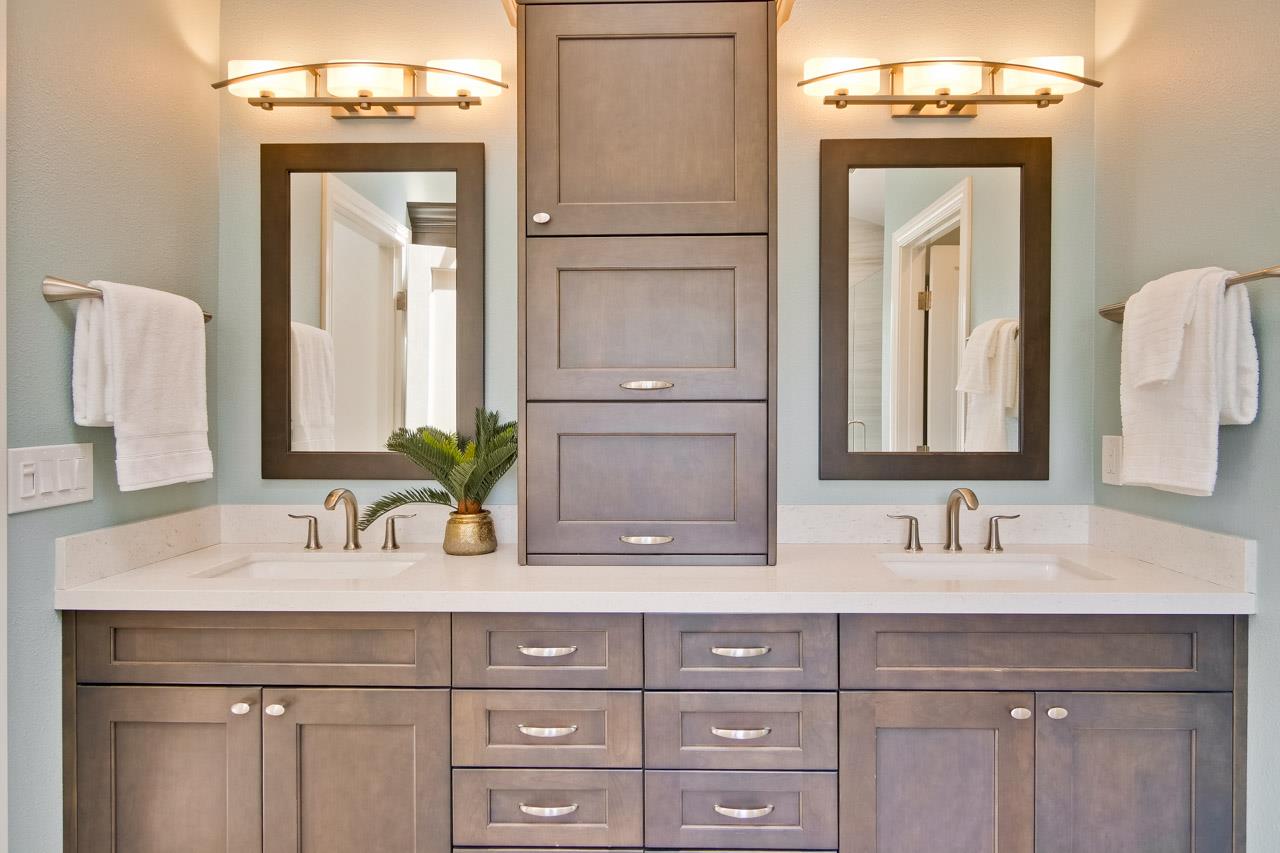 22266 Hartman Drive Cupertino, CA 95014 - Photo 49 of 73 a bathroom with a sink vanity and a mirror