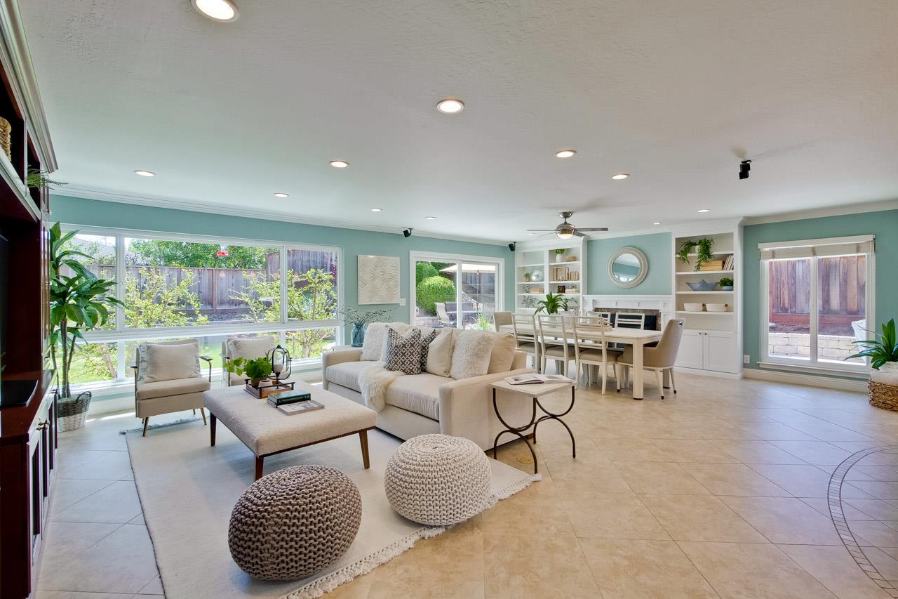 22266 Hartman Drive Cupertino, CA 95014 - Photo 5 of 73 a living room with furniture and a large window