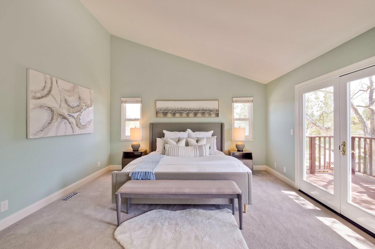 22266 Hartman Drive Cupertino, CA 95014 - Photo 55 of 73 a bedroom with a bed and a large window