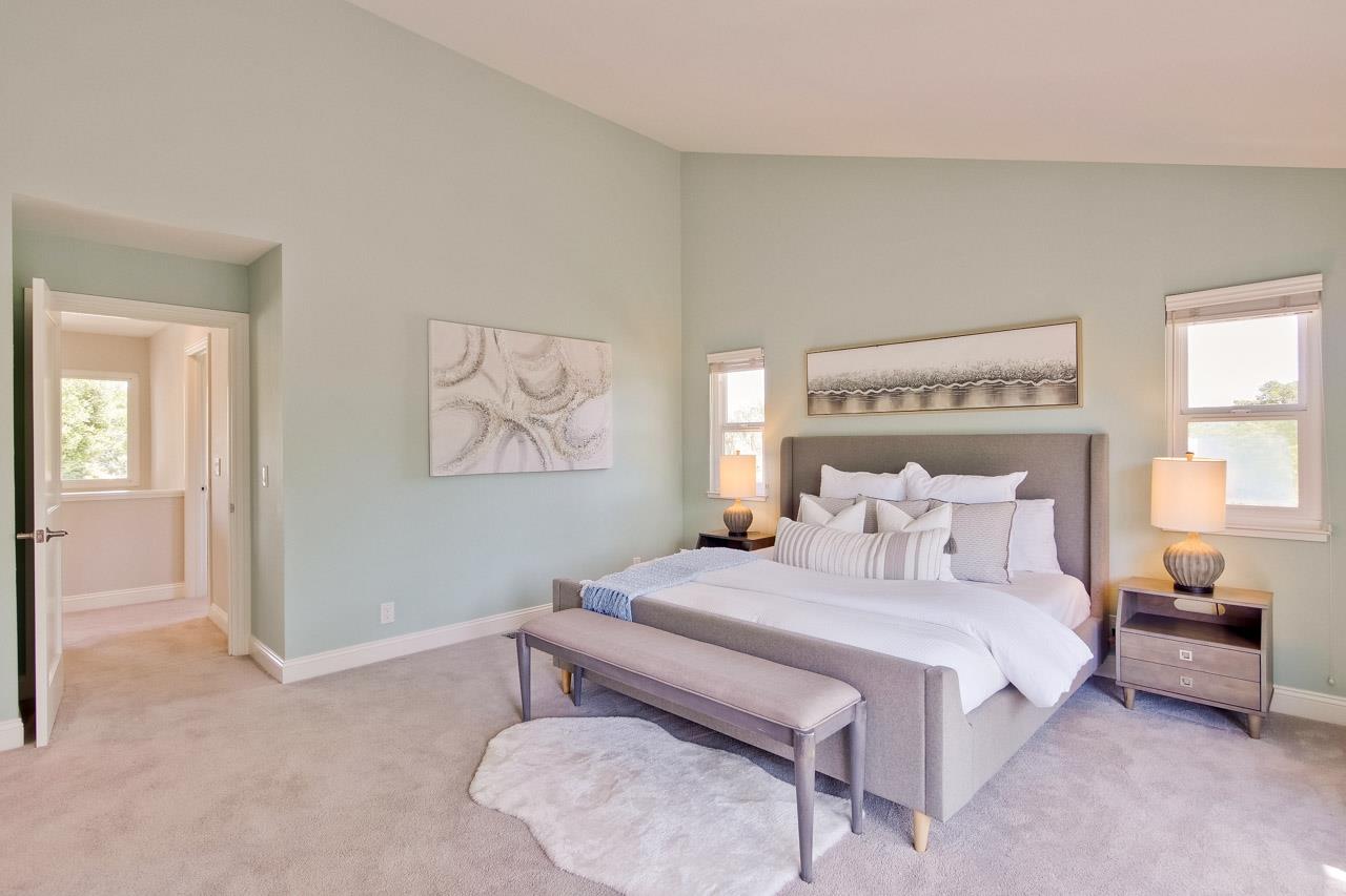 22266 Hartman Drive Cupertino, CA 95014 - Photo 56 of 73 a bedroom with a bed and a lamp