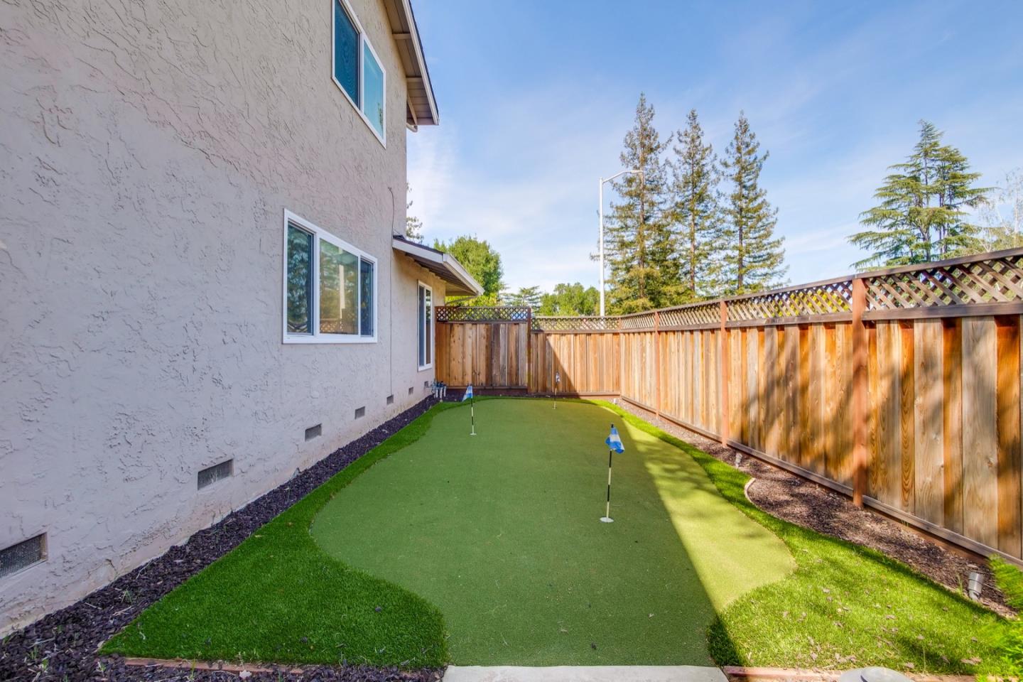 22266 Hartman Drive Cupertino, CA 95014 - Photo 69 of 73 a view of a backyard with a garden
