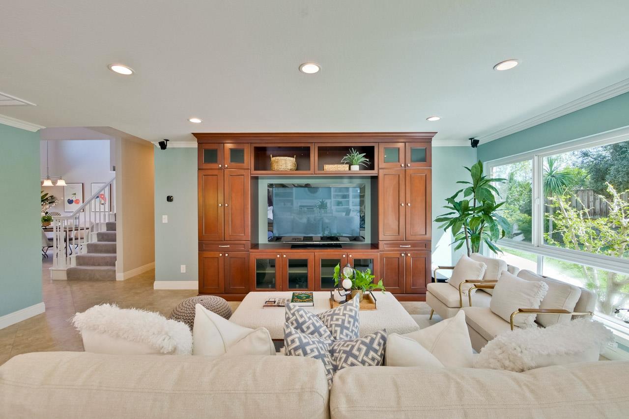 22266 Hartman Drive Cupertino, CA 95014 - Photo 8 of 73 a living room with furniture a window and a potted plant