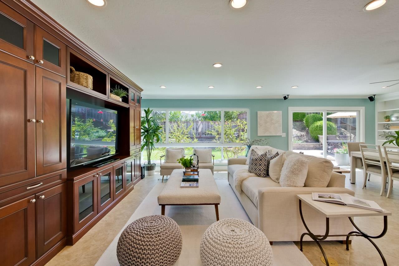 22266 Hartman Drive Cupertino, CA 95014 - Photo 9 of 73 a living room with furniture and a flat screen tv