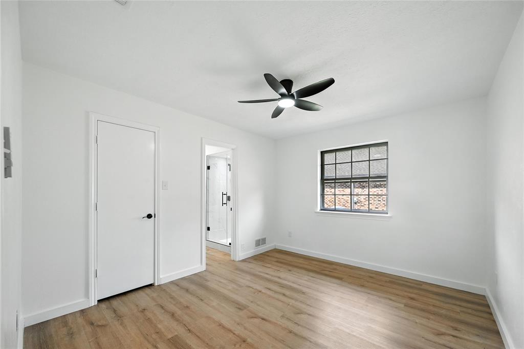 3309 Larkin Lane Rowlett, TX 75089 - Photo 12 of 18 a view of a big room with wooden floor and windows