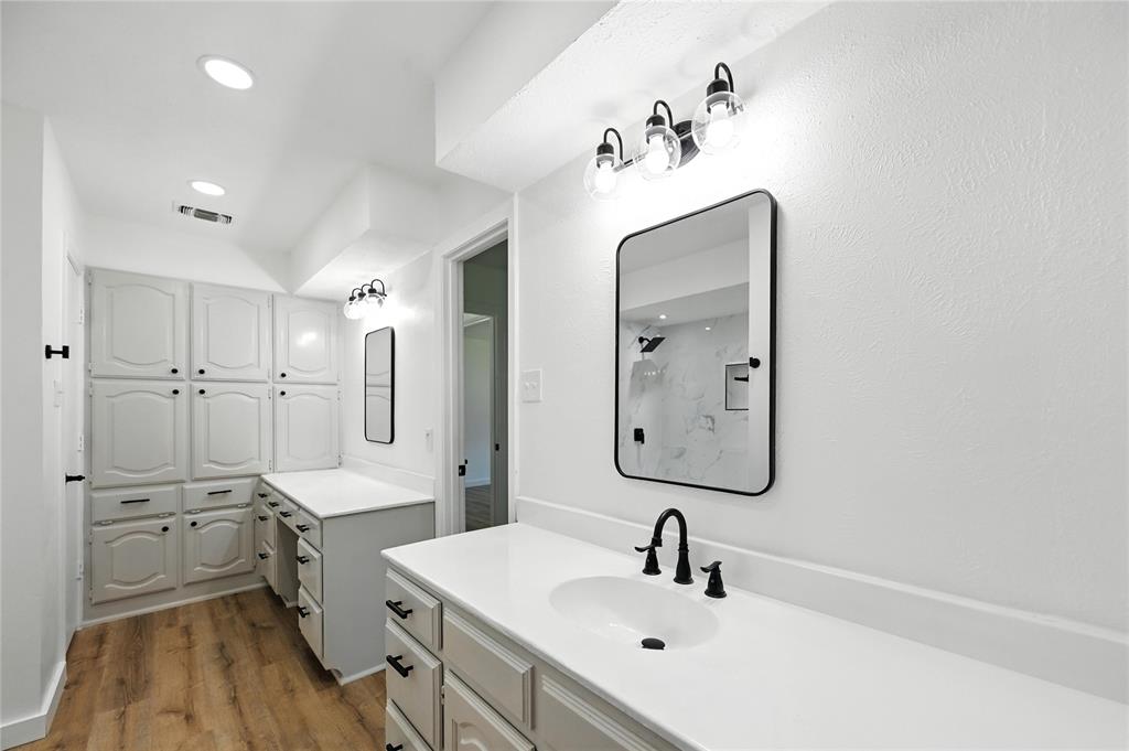 3309 Larkin Lane Rowlett, TX 75089 - Photo 14 of 18 a bathroom with a double vanity sink mirror double and dryer