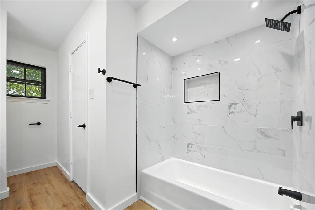 3309 Larkin Lane Rowlett, TX 75089 - Photo 15 of 18 a bathroom with a bathtub and shower