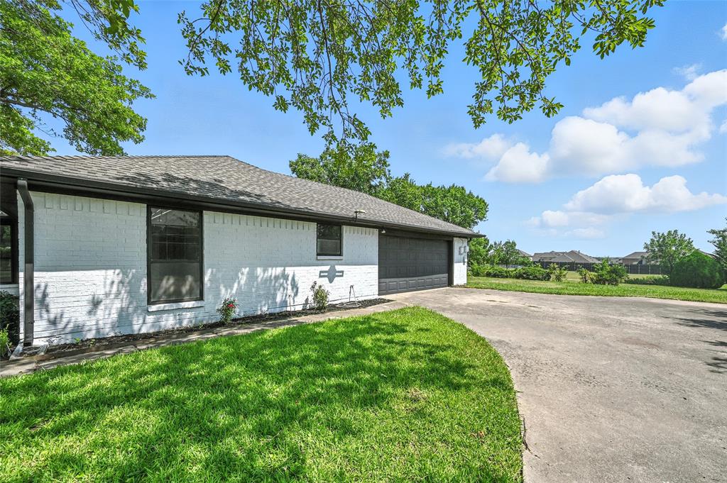 3309 Larkin Lane Rowlett, TX 75089 - Photo 16 of 18 a front view of house with yard and outdoor seating