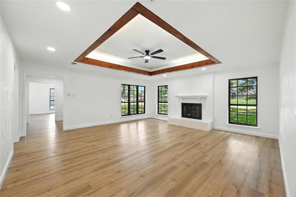 3309 Larkin Lane Rowlett, TX 75089 - Photo 4 of 18 a view of an empty room with wooden floor and a window