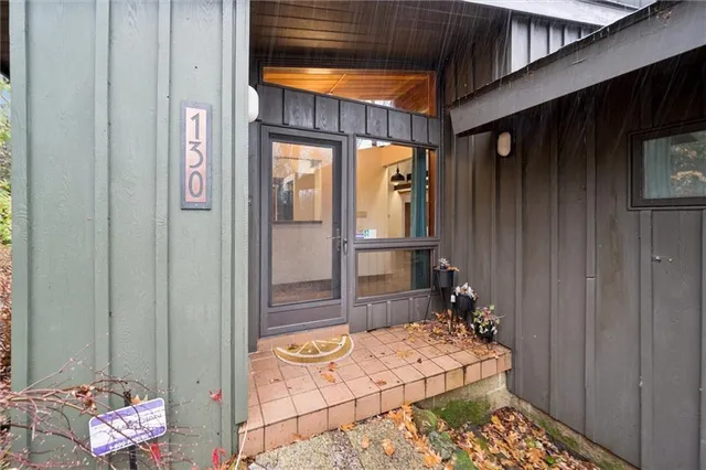 a view of a door and a window