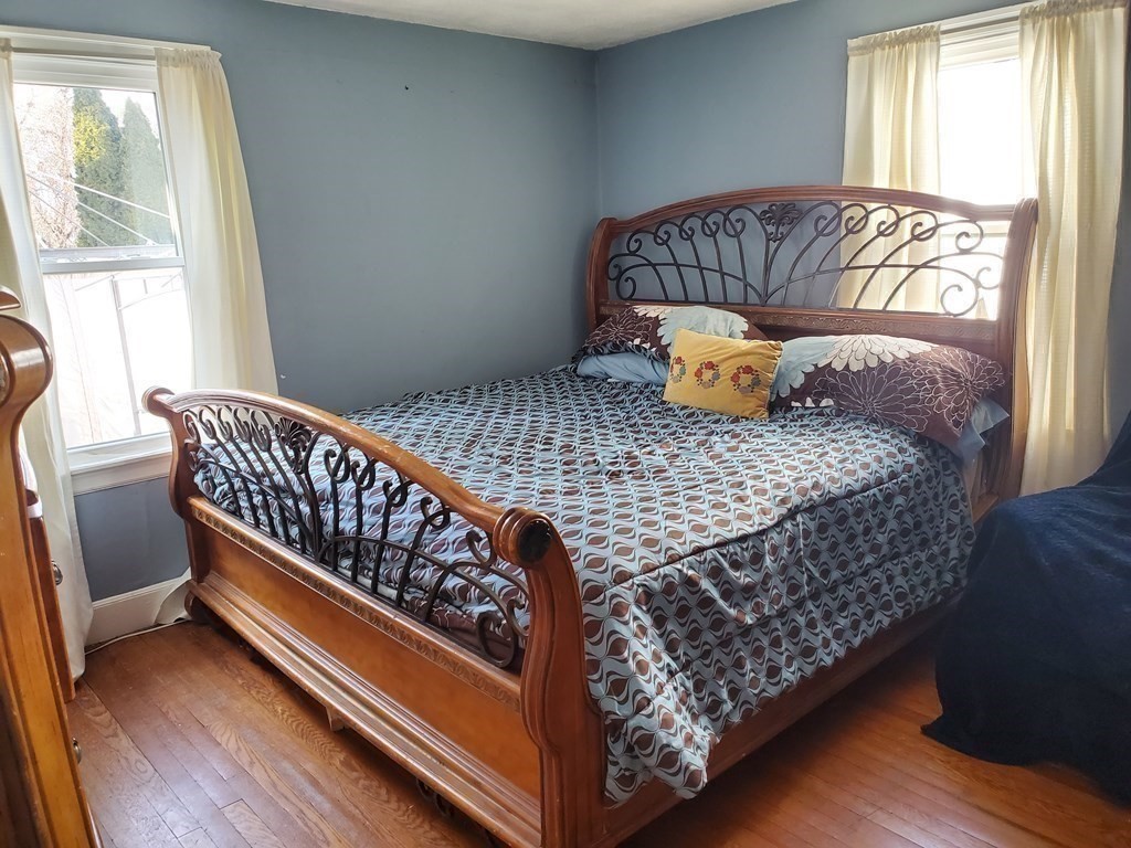 48 Merrill Road Springfield, MA 01119 - Photo 20 of 38 a bedroom with a bed and window