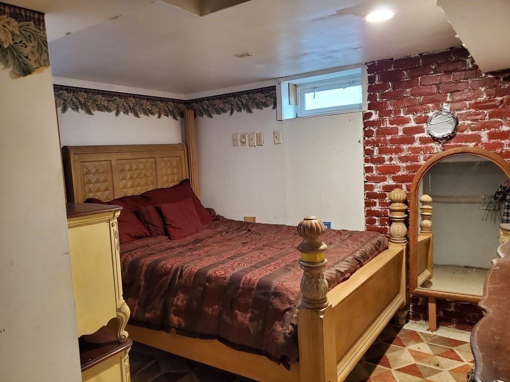 48 Merrill Road Springfield, MA 01119 - Photo 26 of 38 a bedroom with a bed and a window