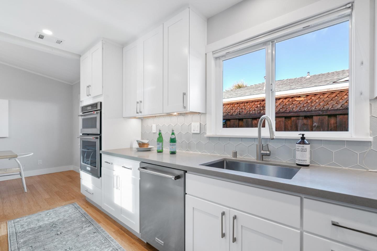643 Crestview Drive San Jose, CA 95050 - Photo 14 of 76 a kitchen with stainless steel appliances granite countertop a sink a stove and a refrigerator