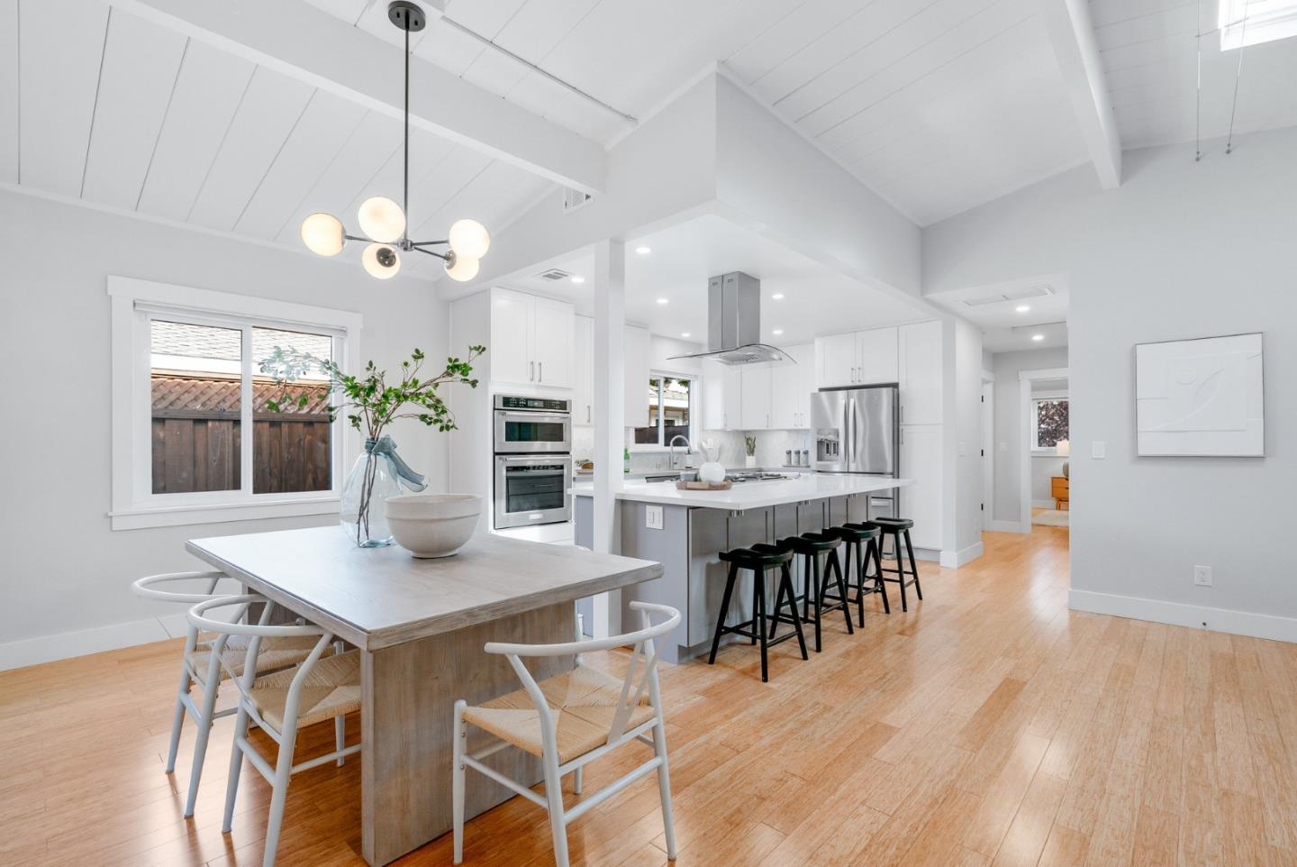 643 Crestview Drive San Jose, CA 95050 - Photo 17 of 76 a view of a dining room and livingroom with furniture wooden floor a chandelier