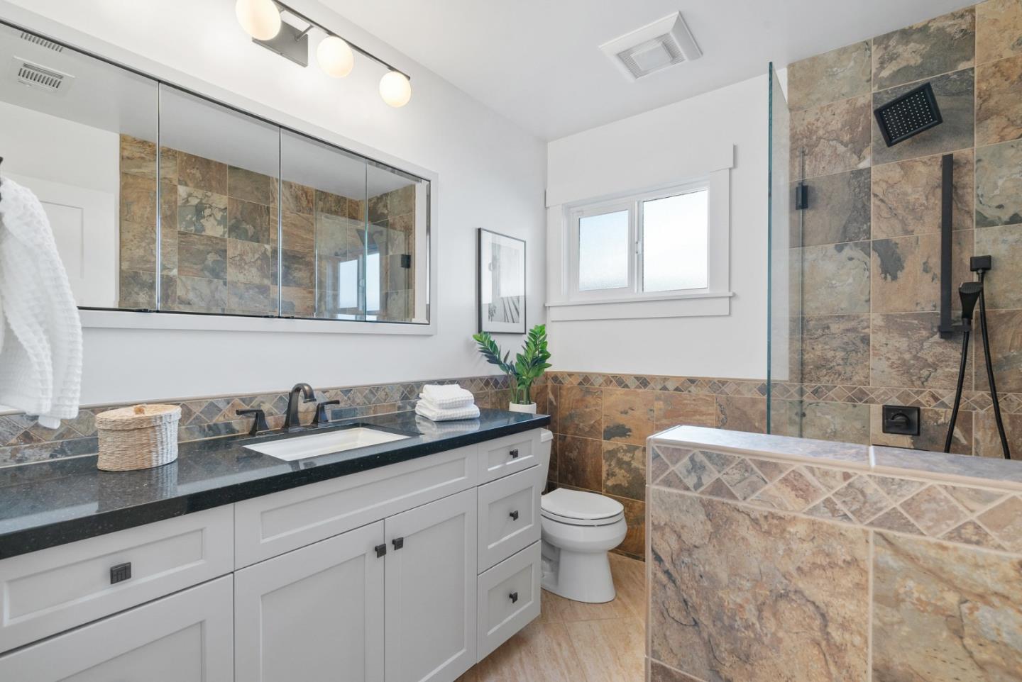 643 Crestview Drive San Jose, CA 95050 - Photo 40 of 76 a bathroom with a granite countertop toilet sink and mirror