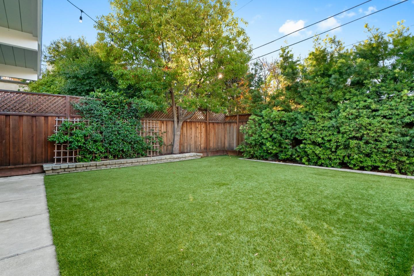 643 Crestview Drive San Jose, CA 95050 - Photo 60 of 76 a view of a backyard with potted plants and large tree