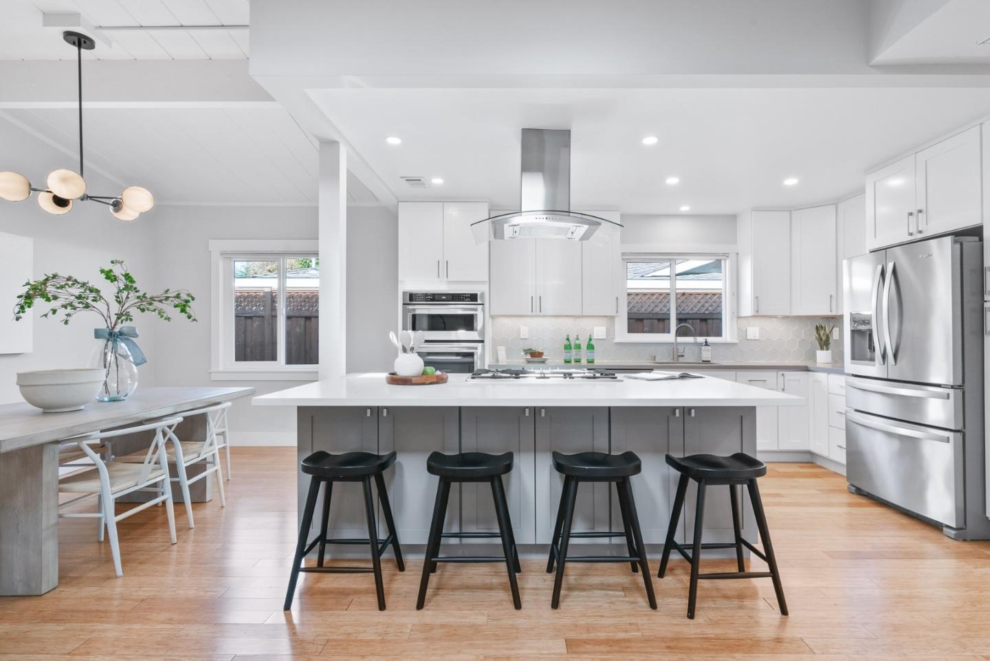 643 Crestview Drive San Jose, CA 95050 - Photo 8 of 76 a kitchen with stainless steel appliances kitchen island granite countertop a table chairs stove and refrigerator