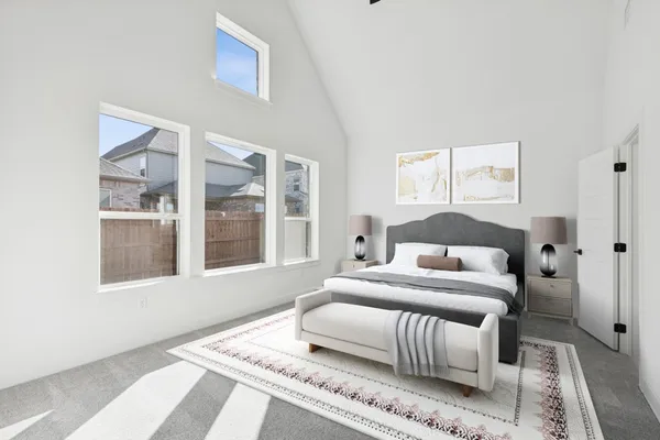 a bedroom with a large bed and a couch