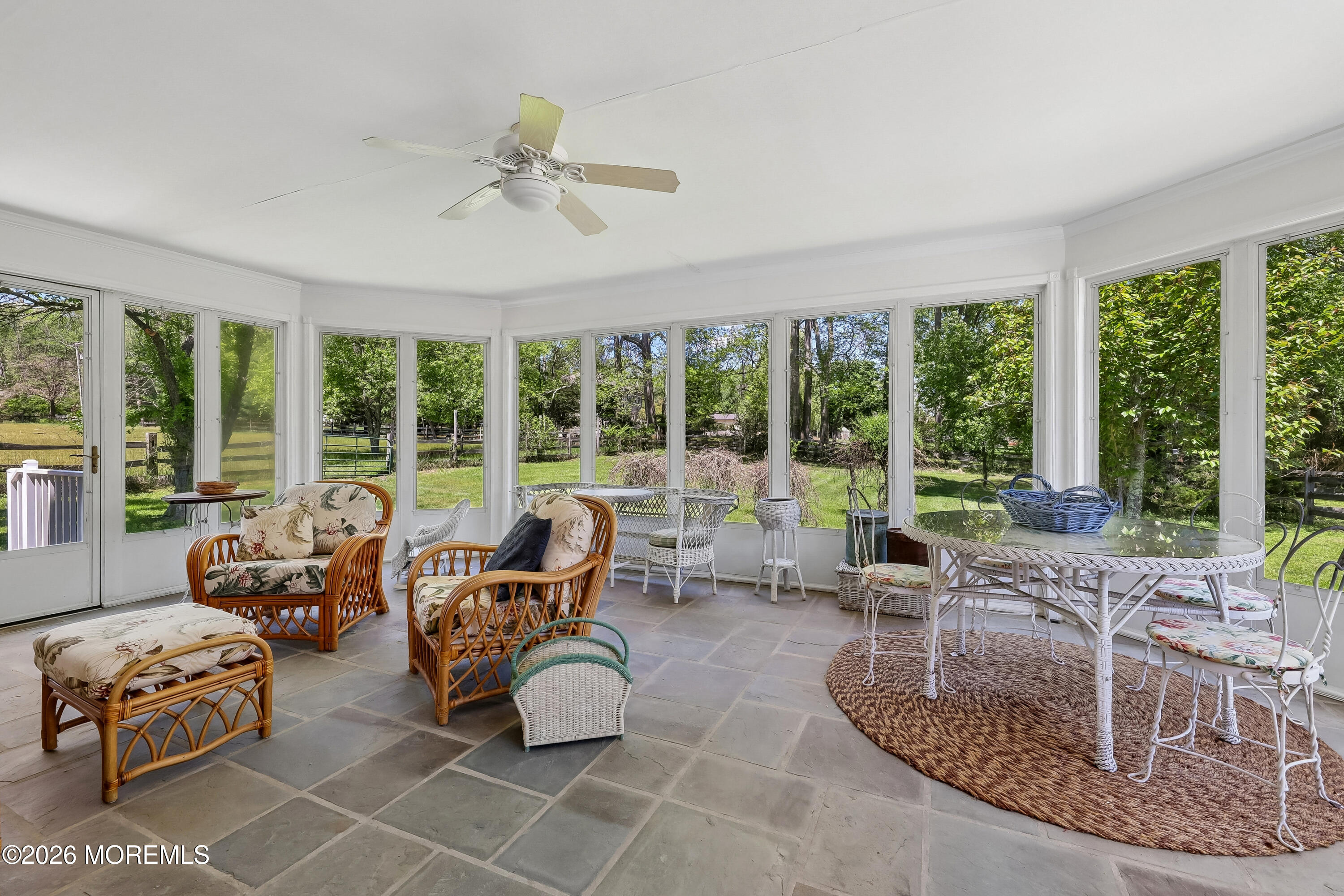 187 Hockhockson Road Colts Neck, NJ 07722 - Photo 35 of 55 a living room with furniture and large windows
