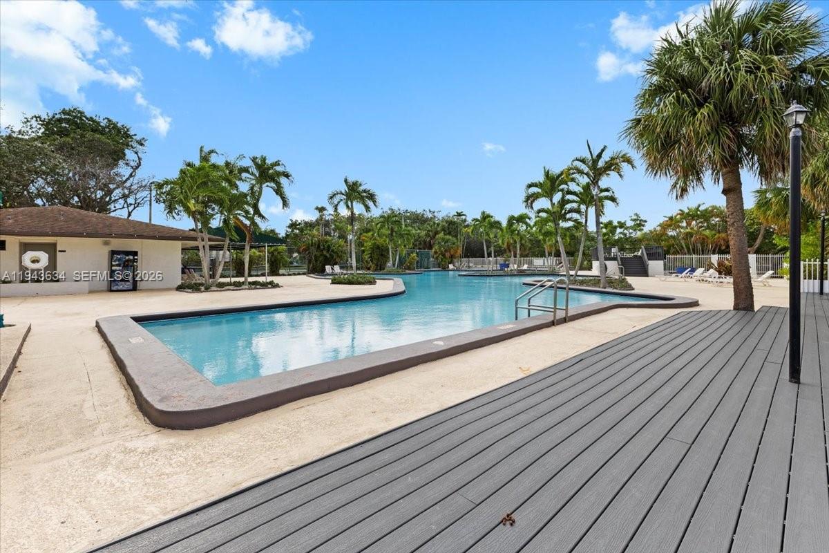 7120 Southwest 112th Avenue Miami, FL 33173 - Photo 23 of 27 a view of swimming pool with outdoor seating and plants