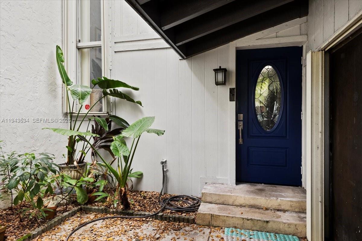 7120 Southwest 112th Avenue Miami, FL 33173 - Photo 3 of 27 a vase of flowers sitting on a floor