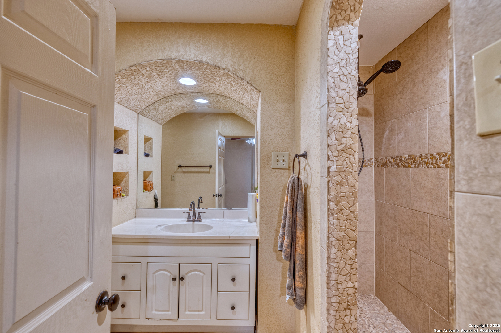 155 Avenida Juarez Road Brackettville, TX 78832 - Photo 13 of 37 a bathroom with a sink a mirror and a shower