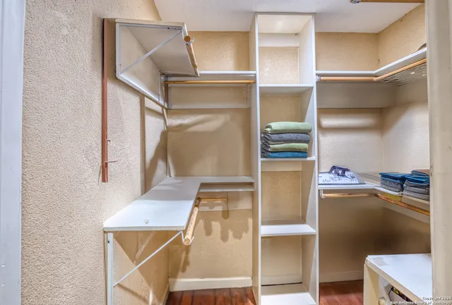 a view of an entryway with wooden floor and fan