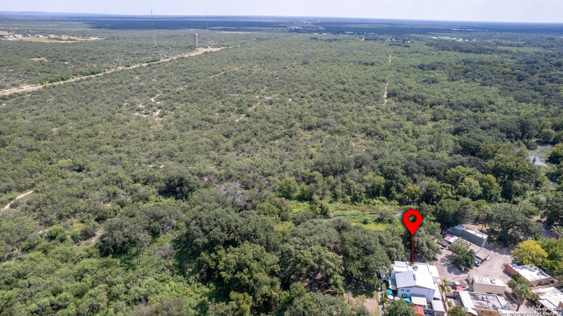 155 Avenida Juarez Road Brackettville, TX 78832 - Photo 36 of 37 a view of a field with an outdoor and trees