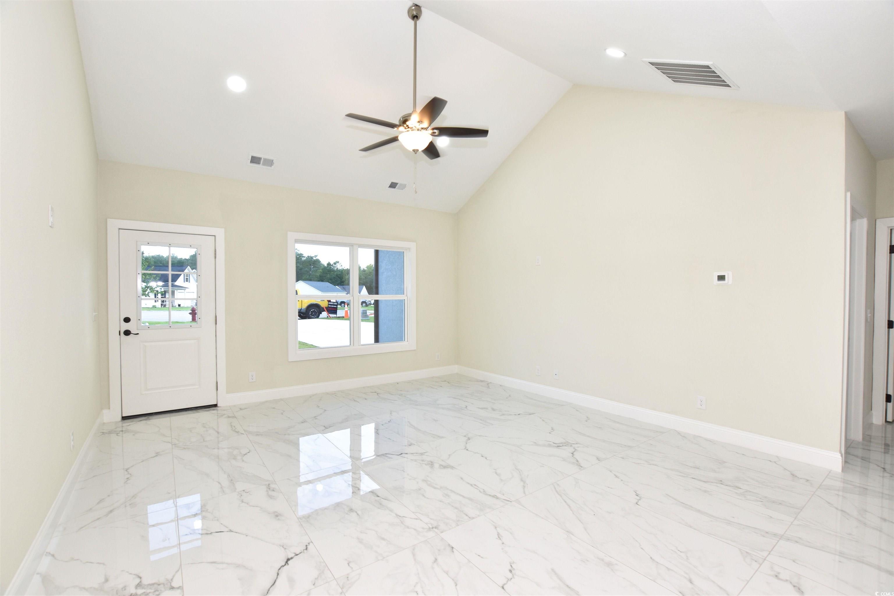 321 Stone Crop Court Loris, SC 29569 - Photo 4 of 25 Unfurnished living room featuring sink, light tile