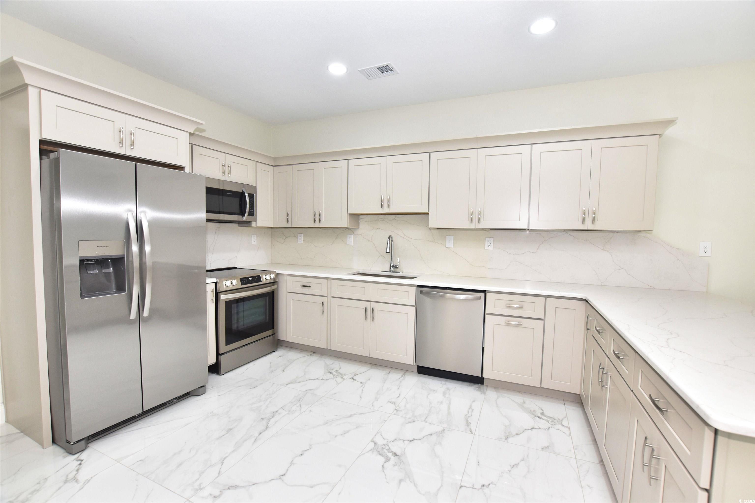 321 Stone Crop Court Loris, SC 29569 - Photo 6 of 25 Kitchen featuring light tile patterned flooring, s