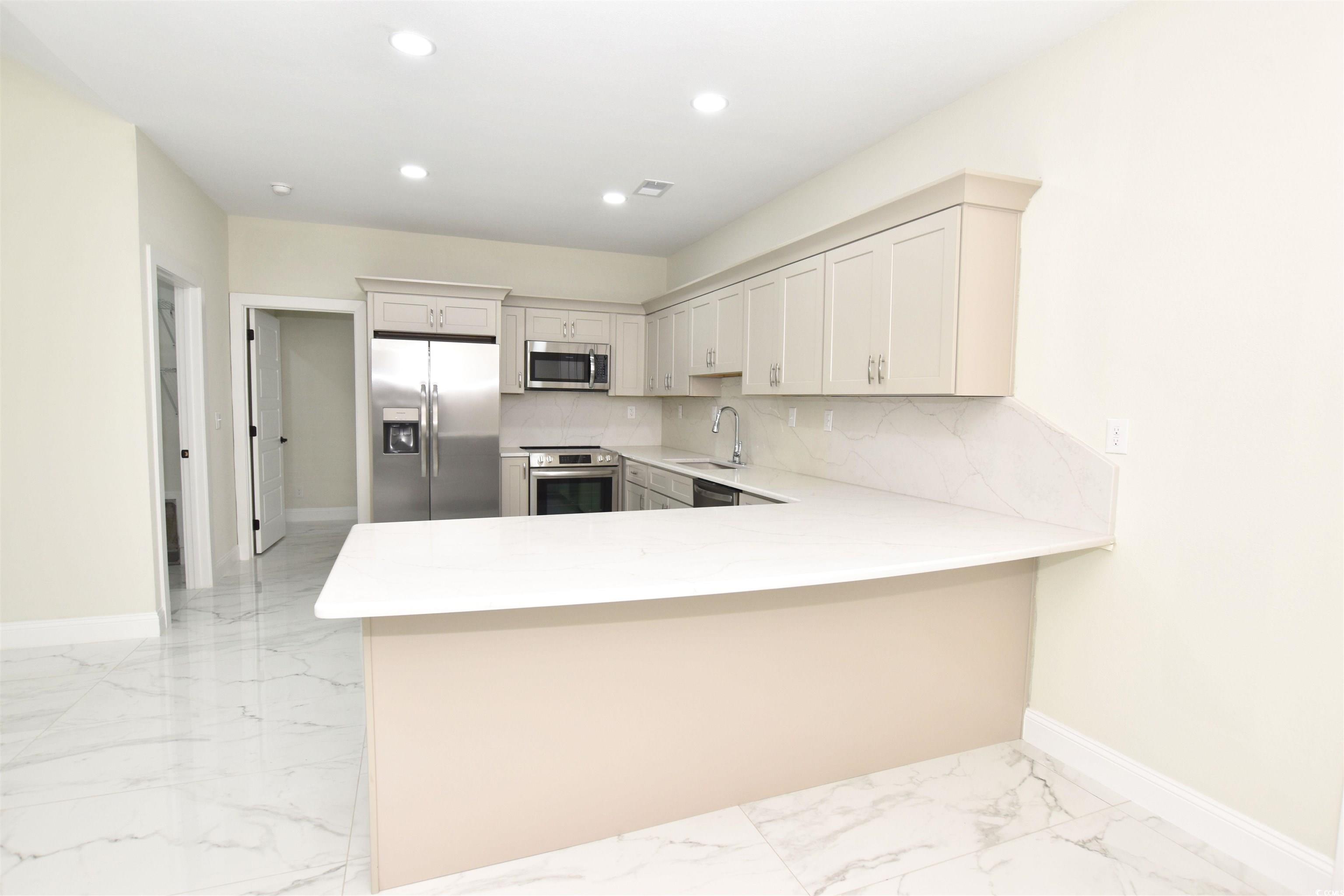 321 Stone Crop Court Loris, SC 29569 - Photo 7 of 25 Kitchen with appliances with stainless steel finis