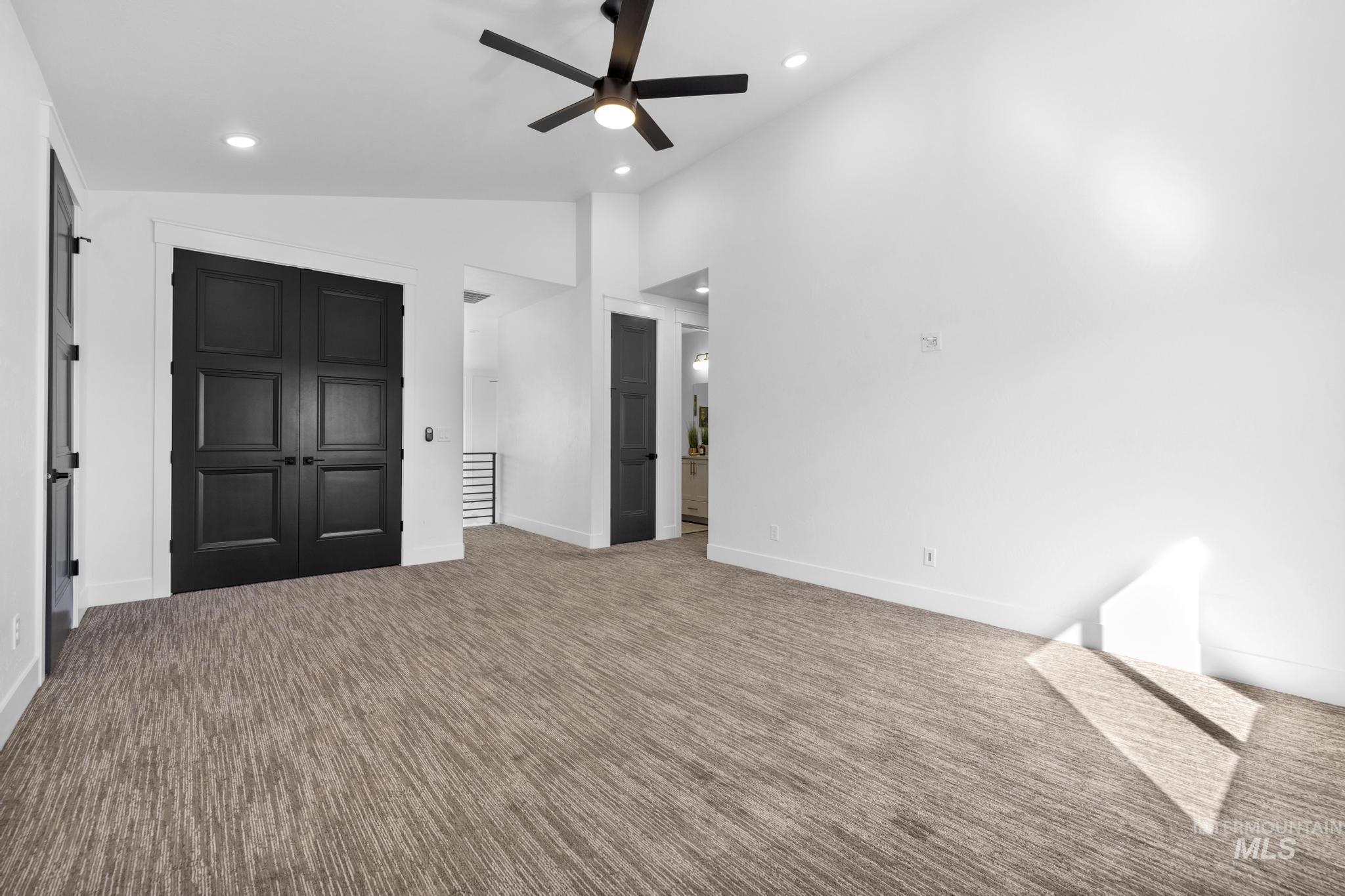 4280 Rim Vista Road Filer, ID 83328 - Photo 34 of 50 Vaulted ceilings, recessed lighting, ceiling fan, contemporary carpeting, and black paneled doors