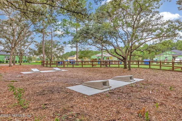 a view of outdoor space with garden and lots of trees