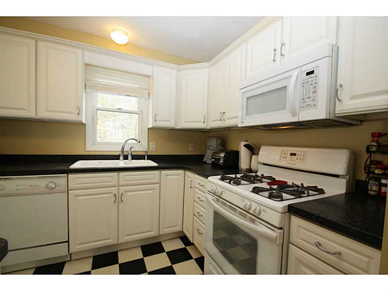 Kitchen. The appliances all convey with the house; gas cooktop, built in microwave, dishwasher, refrigerator and the washer and dryer in the lower level.